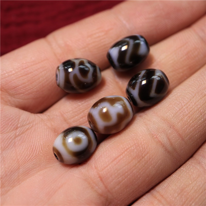 藏傳瑪瑙玉髓材質達洛天珠吊墜藏式虎牙水紋寶瓶蓮花三眼達洛天珠1入